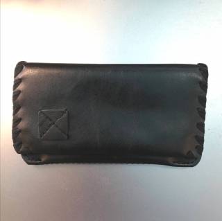 Small black handmade tobacco case